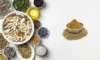 Cumin seeds and supplements on a wooden table