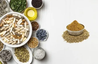 Cumin seeds and supplements on a wooden table
